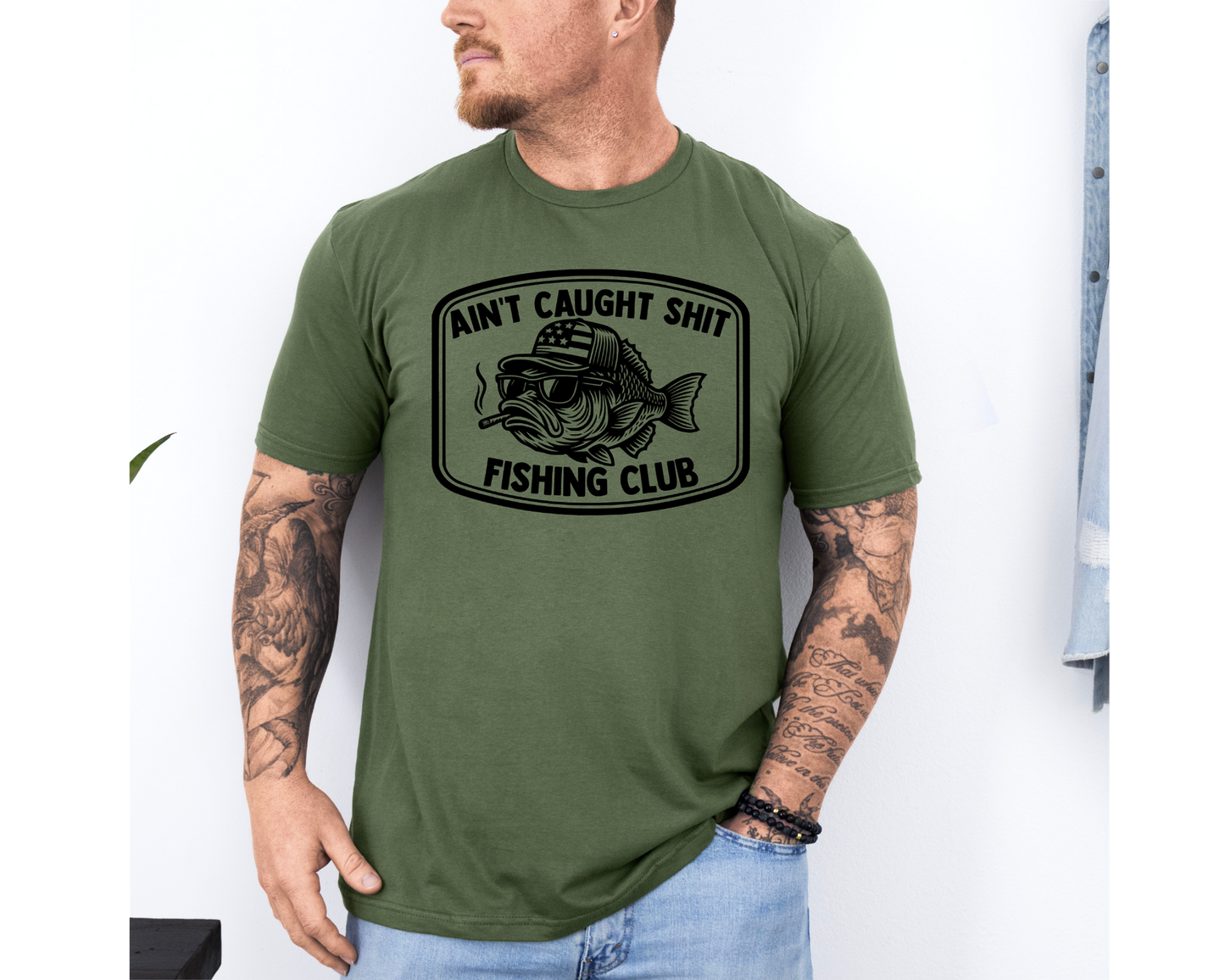 Ain't Caught Shit Fishing Club Trucker Hat & Graphic T-Shirt | Funny Fishing Shirt | Bass Fisherman Gift | Lake Life Apparel | Dad Gift