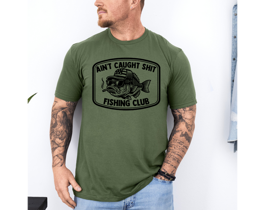 Ain't Caught Shit Fishing Club Trucker Hat & Graphic T-Shirt | Funny Fishing Shirt | Bass Fisherman Gift | Lake Life Apparel | Dad Gift
